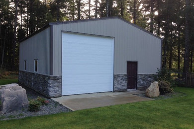 Garage - large traditional detached garage idea in Vancouver