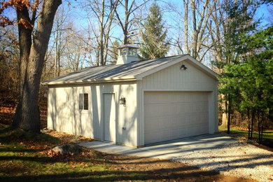 Garage - mid-sized traditional detached one-car garage idea in Grand Rapids