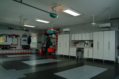 Example of a mid-sized urban attached two-car garage design in Orlando