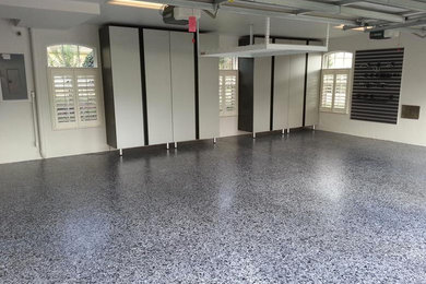 Medium sized contemporary attached garage in Orlando with three or more cars.