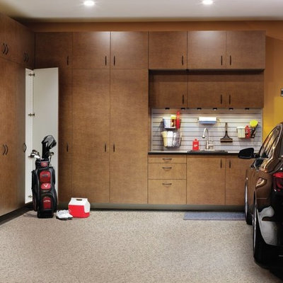 Example of a large transitional attached garage design in Other