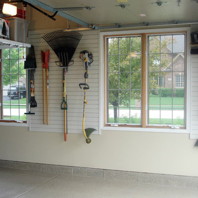 Garage workshop - mid-sized transitional attached garage workshop idea in Kansas City