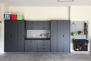 Inspiration for a medium sized contemporary attached double garage in St Louis.