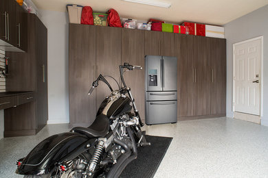 Example of a mid-sized minimalist attached two-car garage design in Miami