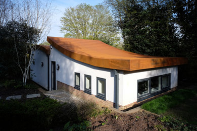 This is an example of a small contemporary detached garage workshop in Buckinghamshire.