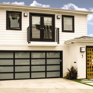 Trendy attached two-car garage photo in Dallas
