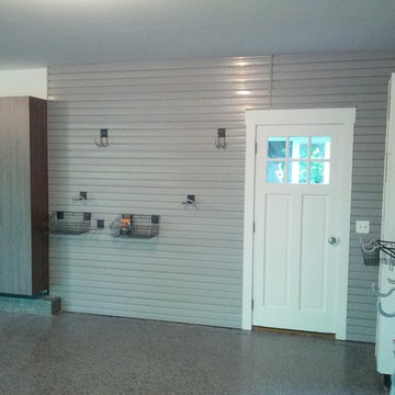 Gray Slatwall from Floor to Ceiling. Custom fit around doors and stemwalls