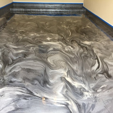 Grey pearl and black metallic epoxy garage floor