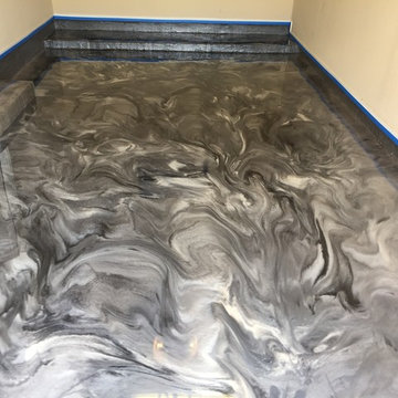Grey pearl and black metallic epoxy garage floor