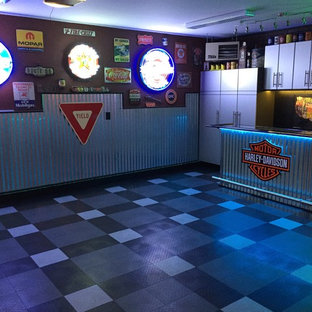Inspiration for a mid-sized attached two-car garage remodel in Other