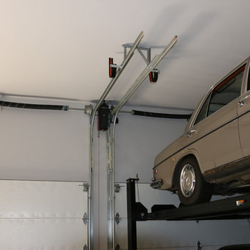 High-lifted, wood-free overhead garage doors with car lift