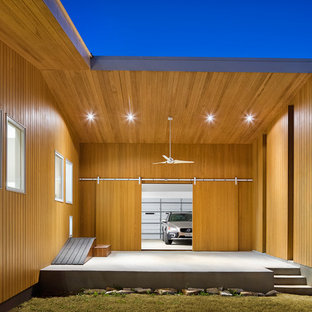 Inspiration for a mid-sized contemporary attached two-car garage remodel in Austin