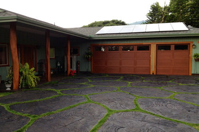 Island style two-car garage photo in Hawaii