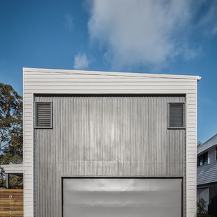 Photo of a beach style attached two-car garage in Gold Coast - Tweed.