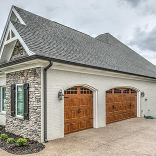 Inspiration for a country attached three-car garage in Louisville.