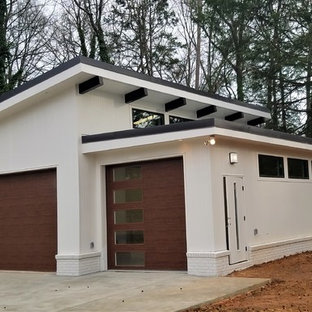 Ispirazione per un grande garage per tre auto indipendente moderno