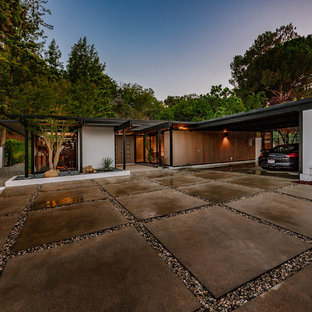 Design ideas for a large midcentury attached two-car carport in Los Angeles.