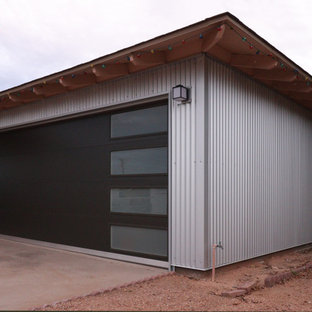 Example of a mid-sized minimalist attached two-car garage design in Phoenix