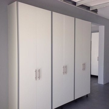 Modern/Industrial Garage - White Cabinets with Chrome Trim Edge