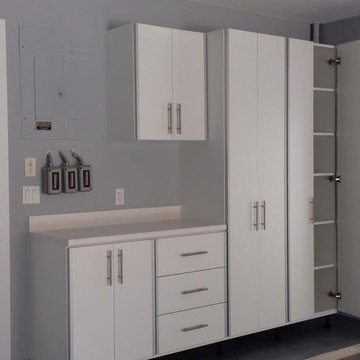Modern/Industrial Garage - White Cabinets with Chrome Trim Edge