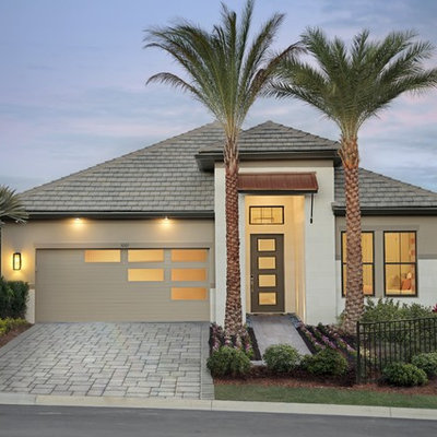 Inspiration for a mid-sized tropical attached two-car garage remodel in Other
