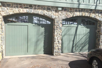 Inspiration for a mid-sized timeless attached two-car garage remodel in Denver
