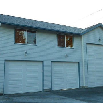 New Construction Garage with a Car Lift and Storage