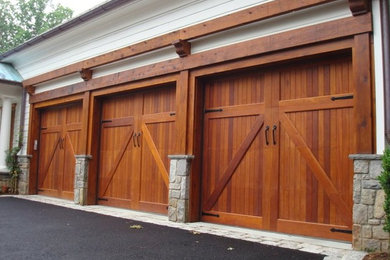 Photo of a medium sized traditional attached carport in Boston with three or more cars.