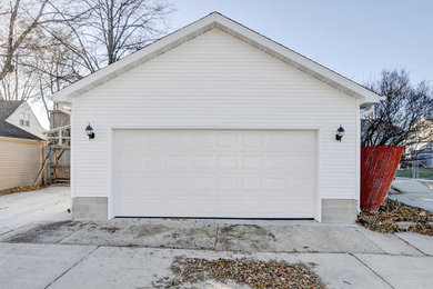 Mid-sized elegant detached two-car garage photo in Milwaukee