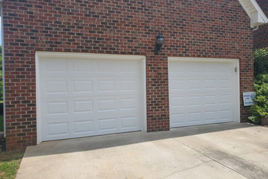 Garage - mid-sized traditional attached one-car garage idea in Raleigh
