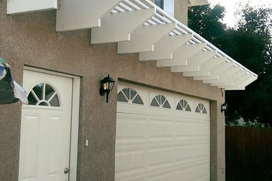 Example of a mid-sized classic attached one-car garage design in Orange County