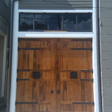 New Orleans historic carriage house doors with dark bronze hardware