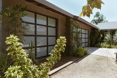 Example of a mid-sized trendy attached two-car carport design in Orange County