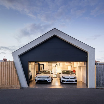 Example of a mid-sized trendy attached two-car carport design in Melbourne