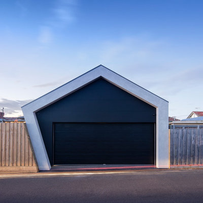 Example of a mid-sized trendy attached two-car carport design in Melbourne