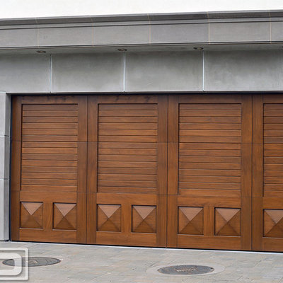 Large transitional two-car garage photo in Orange County