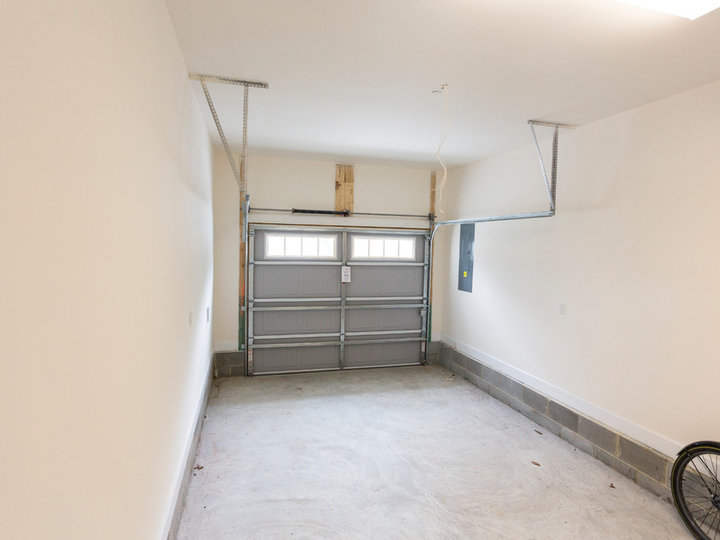 Garage - mid-sized coastal attached one-car garage idea