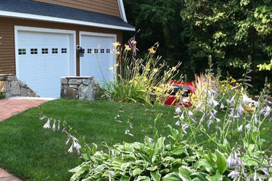 Example of a large classic detached two-car garage workshop design in Boston