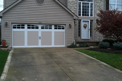 Example of a classic attached two-car garage design in Columbus