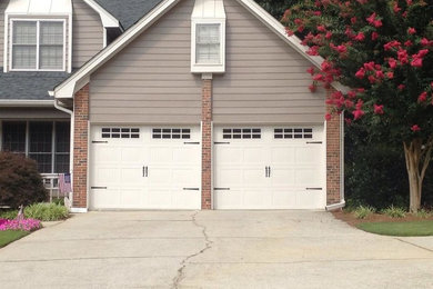 Garage - modern attached two-car garage idea in Atlanta