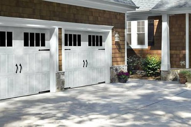 Mid-sized elegant attached two-car garage photo in New York