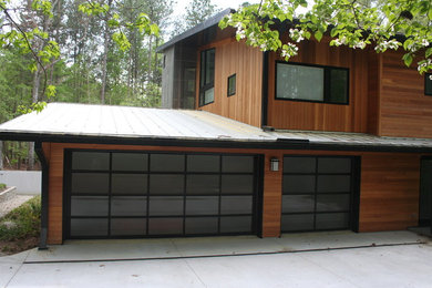 Inspiration for a mid-sized modern attached three-car carport remodel in Raleigh