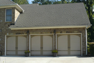 Garage - attached three-car garage idea in Atlanta