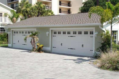 Garage - mid-sized cottage detached two-car garage idea in Tampa