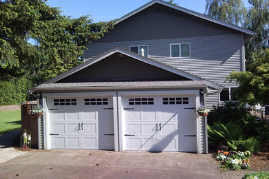 Example of a mid-sized attached two-car garage design in Portland