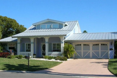 Garage - country attached two-car garage idea in Tampa