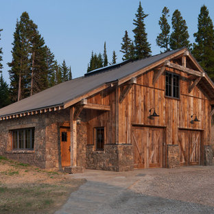 Inspiration for a rustic detached two-car garage remodel in Other