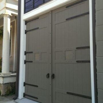 Painted carriage house doors after the requirement to change from exposed wood