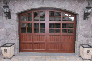 Mid-sized elegant attached one-car garage photo in New York