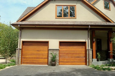 Example of a large classic attached two-car garage design in New York